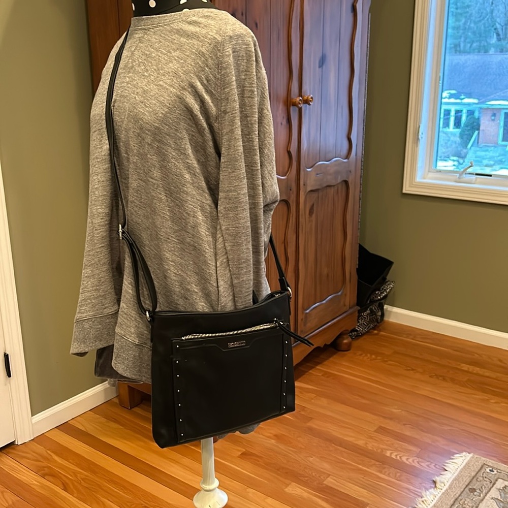 Rosetta black crossbody with adjustable strap.